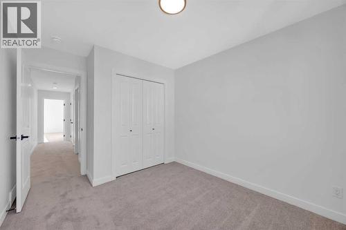 14 Versant Path Sw, Calgary, AB - Indoor Photo Showing Other Room