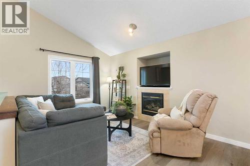 20 Willow Brook Crescent Nw, Airdrie, AB - Indoor Photo Showing Living Room With Fireplace