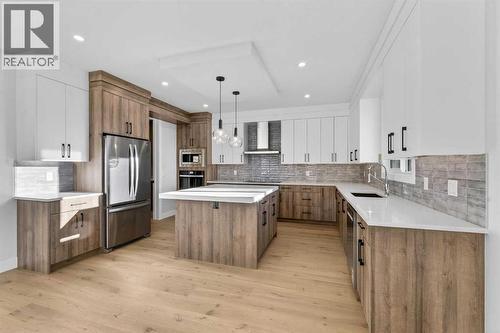 202 Kinniburgh Loop, Chestermere, AB - Indoor Photo Showing Kitchen With Upgraded Kitchen