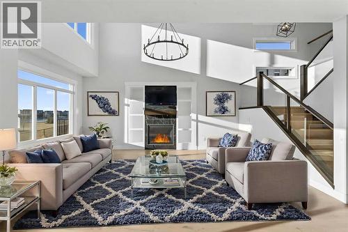 Virtually Staged - 202 Kinniburgh Loop, Chestermere, AB - Indoor Photo Showing Living Room With Fireplace
