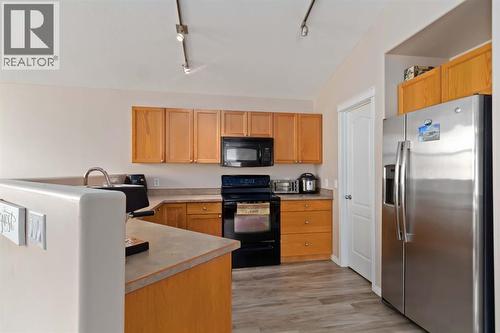 228 Paris Crescent, Fort Mcmurray, AB - Indoor Photo Showing Kitchen