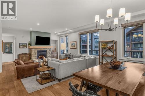 Spacious living areas - 313, 1408 Spring Creek Gate, Canmore, AB - Indoor Photo Showing Living Room With Fireplace