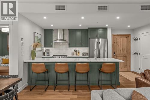 Large eating bar - 313, 1408 Spring Creek Gate, Canmore, AB - Indoor Photo Showing Other Room