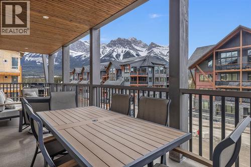 30' covered deck - 313, 1408 Spring Creek Gate, Canmore, AB - Outdoor With Deck Patio Veranda With Exterior