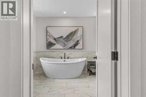 The first of two ensuites - 313, 1408 Spring Creek Gate, Canmore, AB - Indoor Photo Showing Bathroom