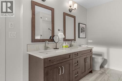 Dual vanities - 313, 1408 Spring Creek Gate, Canmore, AB - Indoor Photo Showing Bathroom