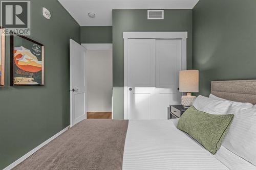 313, 1408 Spring Creek Gate, Canmore, AB - Indoor Photo Showing Bedroom