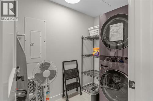 313, 1408 Spring Creek Gate, Canmore, AB - Indoor Photo Showing Laundry Room