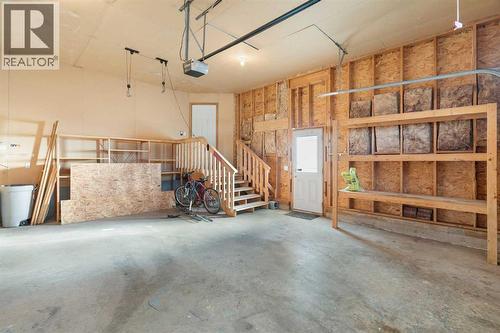 95 Cambridge Glen Drive, Strathmore, AB - Indoor Photo Showing Garage