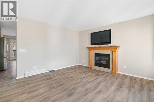 95 Cambridge Glen Drive, Strathmore, AB - Indoor Photo Showing Living Room With Fireplace