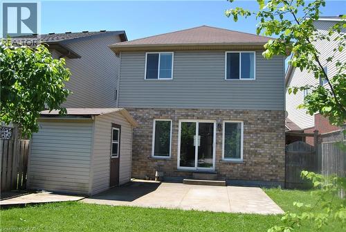 Back of house featuring a fenced backyard, a patio area, and an outbuilding - 154 Harding Street, Kitchener, ON - Outdoor With Exterior