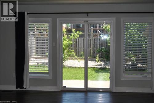 Doorway with baseboards and wood finished floors - 154 Harding Street, Kitchener, ON - Indoor Photo Showing Other Room