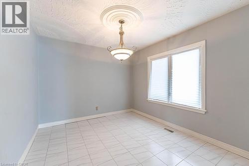 Unfurnished room featuring baseboards, visible vents, and a textured ceiling - 854 West 5Th Street, Hamilton, ON - Indoor Photo Showing Other Room