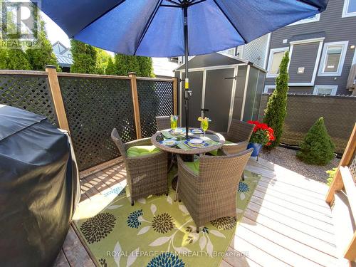 Summer 2025 photo Lower deck view of backyard shed - 979 Shimmerton Circle, Ottawa, ON - Outdoor With Deck Patio Veranda With Exterior