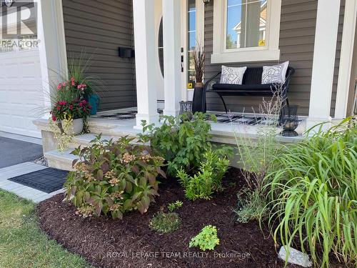 Summer 2025 photo of front covered porch - 979 Shimmerton Circle, Ottawa, ON - Outdoor With Deck Patio Veranda