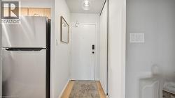 Corridor featuring light wood-style floors - 