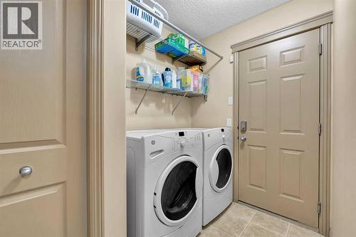 main floor laundry - 270 Everstone Drive Sw, Calgary, AB - Indoor Photo Showing Laundry Room