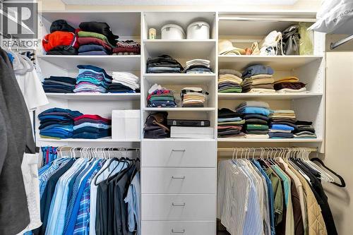 walk-in closet (primary bedroom) - 270 Everstone Drive Sw, Calgary, AB - Indoor With Storage