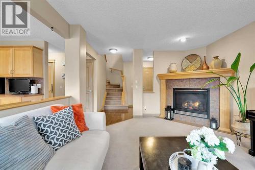 270 Everstone Drive Sw, Calgary, AB - Indoor Photo Showing Living Room With Fireplace