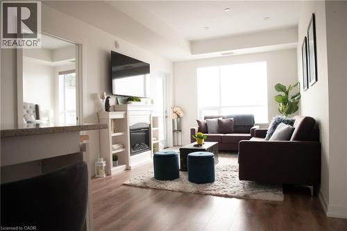 255 Northfield Drive E Unit# 506, Waterloo, ON - Indoor Photo Showing Living Room With Fireplace