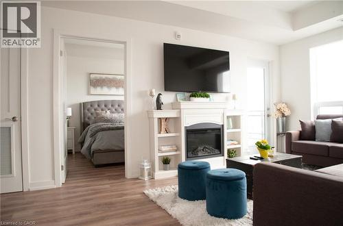 255 Northfield Drive E Unit# 506, Waterloo, ON - Indoor Photo Showing Living Room With Fireplace