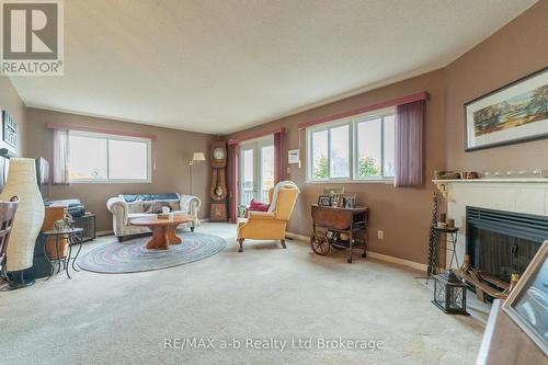 Living Room - 8 - 19 Wren Court, Tillsonburg, ON - Indoor Photo Showing Other Room With Fireplace