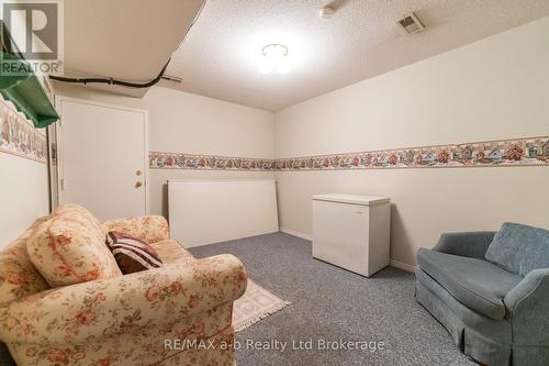 Rec Room with Access to Shared Hallway to Garage - 8 - 19 Wren Court, Tillsonburg, ON - Indoor