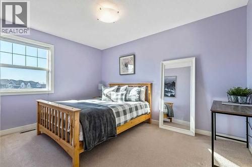 718 Hamptons Bay Se, High River, AB - Indoor Photo Showing Bedroom