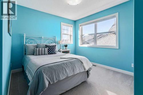 718 Hamptons Bay Se, High River, AB - Indoor Photo Showing Bedroom