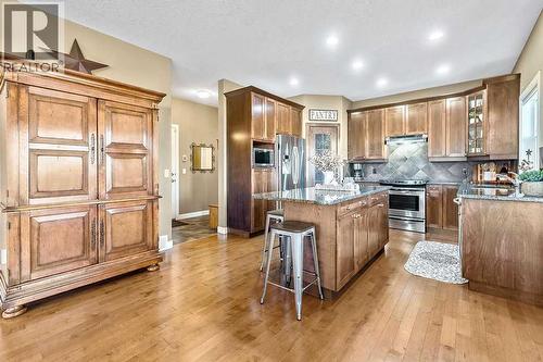 718 Hamptons Bay Se, High River, AB - Indoor Photo Showing Kitchen With Stainless Steel Kitchen
