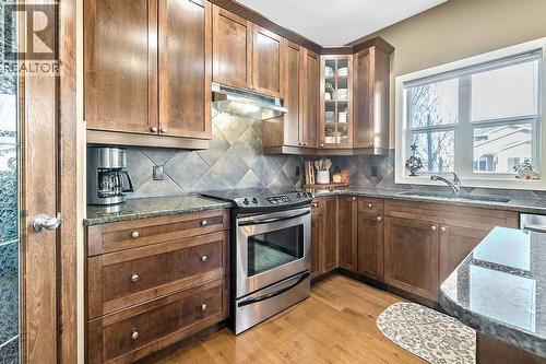 718 Hamptons Bay Se, High River, AB - Indoor Photo Showing Kitchen With Stainless Steel Kitchen With Double Sink