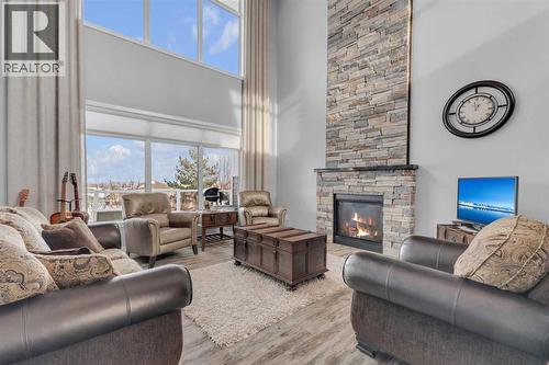 5 Leonard Close, Sylvan Lake, AB - Indoor Photo Showing Living Room With Fireplace