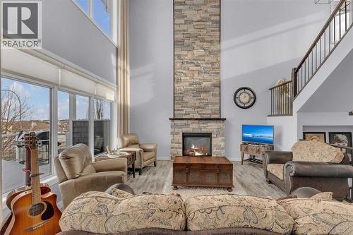 5 Leonard Close, Sylvan Lake, AB - Indoor Photo Showing Living Room With Fireplace