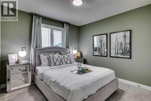 71 Emerson Crescent, Okotoks, AB - Indoor Photo Showing Bedroom