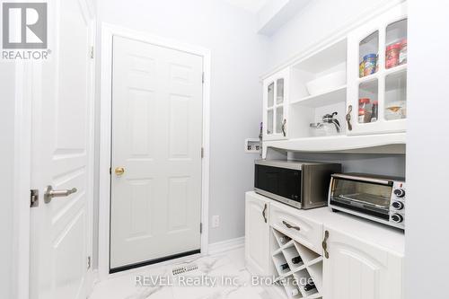 2ND ENTRANCE FROM GARAGE W/LAUNDRY HOOK UP - 8 Elderberry Road, Thorold (Confederation Heights), ON - Indoor Photo Showing Other Room