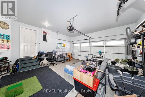 GARAGE W/SECOND ENTRANCE TO HOUSE FROM GARAGE - 8 Elderberry Road, Thorold (Confederation Heights), ON - Indoor Photo Showing Garage