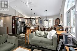 Bright open living area with vaulted ceilings - 