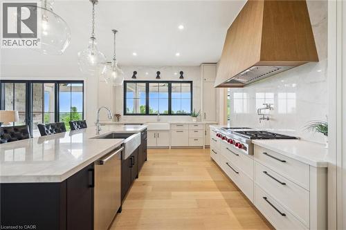 Kitchen with custom range hood, appliances with stainless steel finishes, a sink, a large island, and recessed lighting - 5020 First Line, Erin, ON - Indoor Photo Showing Kitchen With Upgraded Kitchen