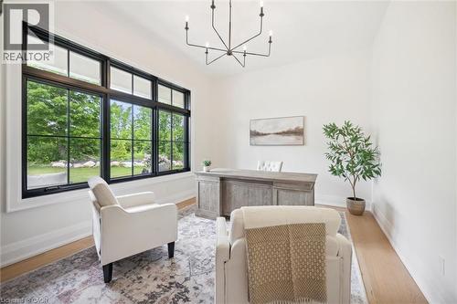 Office space with a chandelier, baseboards, and light wood finished floors - 5020 First Line, Erin, ON - Indoor Photo Showing Other Room