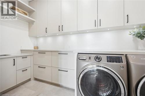 Washroom with separate washer and dryer and cabinet space - 5020 First Line, Erin, ON - Indoor Photo Showing Laundry Room