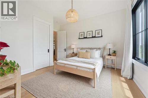 Bedroom with light wood-style flooring and baseboards - 5020 First Line, Erin, ON - Indoor Photo Showing Bedroom