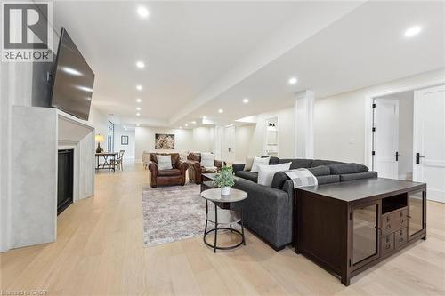 Living area with a fireplace, light wood-style floors, and recessed lighting - 5020 First Line, Erin, ON - Indoor Photo Showing Living Room