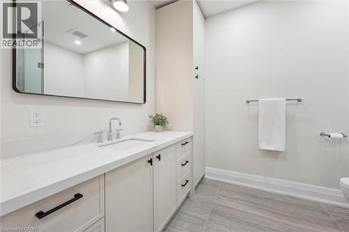 Bathroom featuring vanity, toilet, and baseboards - 5020 First Line, Erin, ON - Indoor Photo Showing Bathroom