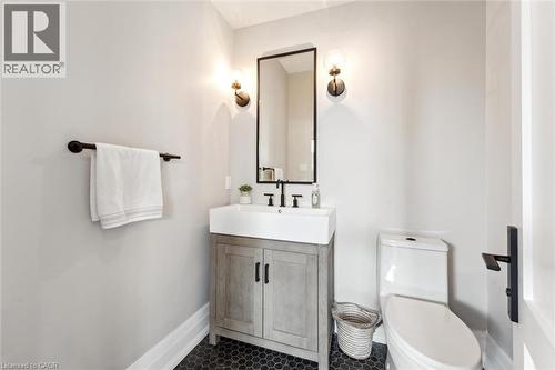 Half bathroom with vanity, toilet, and baseboards - 5020 First Line, Erin, ON - Indoor Photo Showing Bathroom