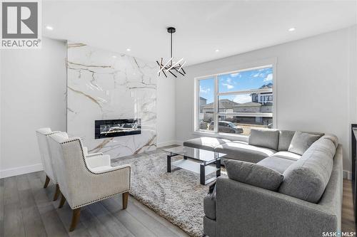836 Ballesteros Crescent, Warman, SK - Indoor Photo Showing Living Room With Fireplace