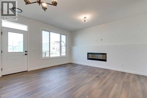 182 Lanark Gate Se, Airdrie, AB - Indoor With Fireplace