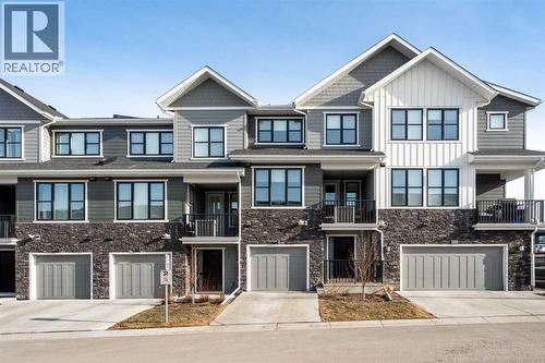 915 Crestridge Common Sw, Calgary, AB - Outdoor With Balcony With Facade