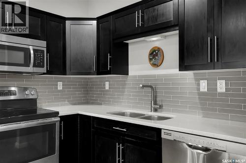 216 545 Hassard Close, Saskatoon, SK - Indoor Photo Showing Kitchen With Double Sink With Upgraded Kitchen