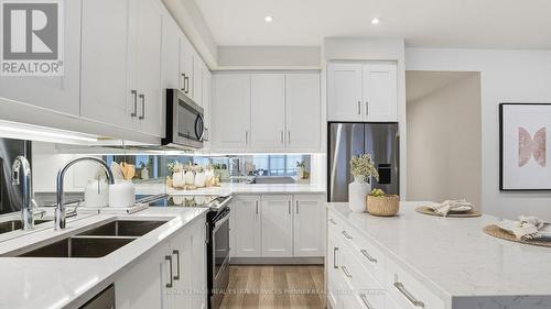201 - 652 Cricklewood Drive, Mississauga, ON - Indoor Photo Showing Kitchen With Double Sink With Upgraded Kitchen