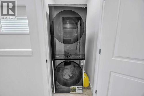 1612 Rangeview Drive Se, Calgary, AB - Indoor Photo Showing Laundry Room